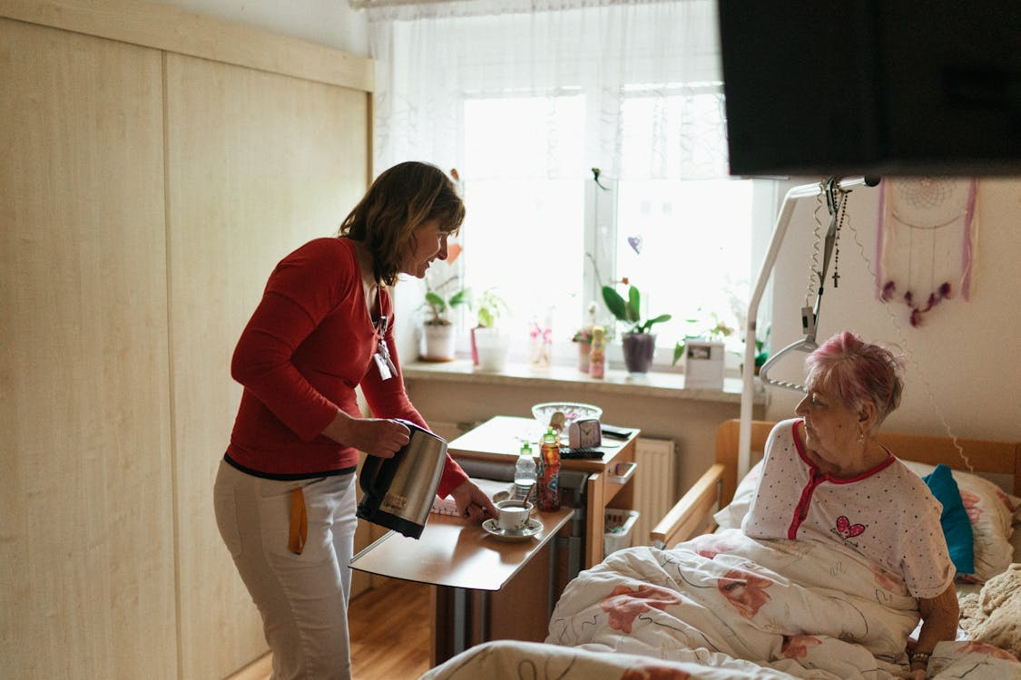 Caregiver assisting elderly family member